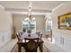 Traditional dining room with a large table and chairs, and a view to another room at 1307 Clarecastle Ln, Buford, GA 30519