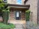 Charming front porch with stone accents and manicured greenery offering a welcoming entrance at 1307 Clarecastle Ln, Buford, GA 30519