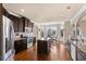Spacious kitchen featuring stainless steel appliances, dark wood cabinets, and eat in breakfast nook at 1307 Clarecastle Ln, Buford, GA 30519
