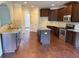 Well-appointed kitchen with dark wood cabinets, stainless steel appliances, and ample counter space at 1307 Clarecastle Ln, Buford, GA 30519