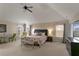 A large main bedroom offering a sitting area and generous natural light at 1307 Clarecastle Ln, Buford, GA 30519