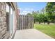 View of patio area in backyard with grassy area and fencing at 2279 Hawks Bluff Trl, Lawrenceville, GA 30044
