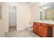 Bright bathroom features a vanity with wood cabinets, white toilet, and walk-in shower at 2279 Hawks Bluff Trl, Lawrenceville, GA 30044