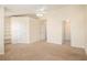 Spacious bedroom with carpet flooring, a ceiling fan, and neutral color palette at 2279 Hawks Bluff Trl, Lawrenceville, GA 30044
