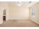 Bright bedroom featuring neutral walls, carpet floors, ceiling fan and natural light at 2279 Hawks Bluff Trl, Lawrenceville, GA 30044