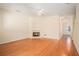 Bright living room featuring hardwood floors and a fireplace at 2279 Hawks Bluff Trl, Lawrenceville, GA 30044