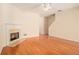 Inviting living room with a cozy fireplace and gleaming hardwood floors at 2279 Hawks Bluff Trl, Lawrenceville, GA 30044