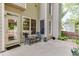 Back patio area with outdoor seating, plants and view of a fenced yard at 352 Hickory Haven Ter, Suwanee, GA 30024