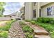 Landscaped backyard with patio, table and chairs, and a stepping stone path at 352 Hickory Haven Ter, Suwanee, GA 30024