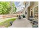 Backyard featuring a patio set, lawn, and a wood fence providing privacy at 352 Hickory Haven Ter, Suwanee, GA 30024