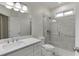 Modern bathroom with a glass shower, a sleek vanity, and contemporary fixtures at 352 Hickory Haven Ter, Suwanee, GA 30024