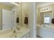 This bathroom offers dual vanities, ample counter space and well-lit mirrors perfect for morning routines at 352 Hickory Haven Ter, Suwanee, GA 30024