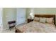 Comfortable bedroom featuring a classic bed, decorative side table and a closet with ample storage at 352 Hickory Haven Ter, Suwanee, GA 30024