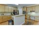 Spacious kitchen with a breakfast bar, stainless steel appliances, and plenty of cabinet space at 352 Hickory Haven Ter, Suwanee, GA 30024