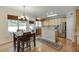 Eat-in kitchen with a dining table, stainless steel appliances, and light wood cabinets at 352 Hickory Haven Ter, Suwanee, GA 30024