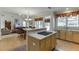 Open kitchen featuring an island cooktop, overlooking the eat-in kitchen and living area at 352 Hickory Haven Ter, Suwanee, GA 30024