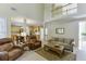 Open-concept living room with a view of the kitchen and a comfortable seating area at 352 Hickory Haven Ter, Suwanee, GA 30024