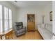 Cozy living room with hardwood floors, shutters, and comfortable seating at 352 Hickory Haven Ter, Suwanee, GA 30024