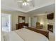 Spacious main bedroom suite showcasing a fireplace, tv, trey ceiling, and an en-suite bathroom at 352 Hickory Haven Ter, Suwanee, GA 30024