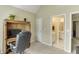 The home office features a built-in desk area adjacent to the en-suite bathroom and bedroom entry at 352 Hickory Haven Ter, Suwanee, GA 30024