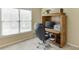 This office features a built-in desk area with storage and natural light from a nearby window at 352 Hickory Haven Ter, Suwanee, GA 30024
