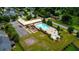 Aerial of the community pool, playground and basket ball court surrounded by lush greenery at 39 Summer Nw Pl, Cartersville, GA 30121