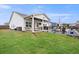 Backyard features covered patio, outdoor kitchen, manicured lawn and patio area at 39 Summer Nw Pl, Cartersville, GA 30121