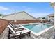 Backyard with swimming pool, lounge chairs, patio, outdoor kitchen and landscaping at 39 Summer Nw Pl, Cartersville, GA 30121
