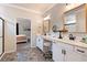 Bathroom featuring dual sinks, decorative mirrors, and modern finishes at 39 Summer Nw Pl, Cartersville, GA 30121