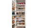 Organized closet featuring built-in shelving filled with a variety of shoes and boots at 39 Summer Nw Pl, Cartersville, GA 30121