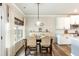 Cozy dining area next to the kitchen with a window view and modern pendant lighting at 39 Summer Nw Pl, Cartersville, GA 30121