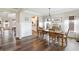 Elegant dining room features wood floors, wainscoting, and a rustic wooden table with seating for six at 39 Summer Nw Pl, Cartersville, GA 30121