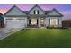 Charming one-story home with a manicured lawn, two-car garage and inviting front porch, showcasing curb appeal at 39 Summer Nw Pl, Cartersville, GA 30121