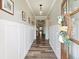Elegant foyer with wood floors, white wainscoting, and decorative accents, creating a warm and inviting entrance at 39 Summer Nw Pl, Cartersville, GA 30121