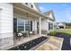 Cozy front porch with seating, stone accents, and a decorative wreath, creating a welcoming entrance to the home at 39 Summer Nw Pl, Cartersville, GA 30121