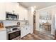 Modern kitchen with stainless steel appliances and adjacent dining area at 39 Summer Nw Pl, Cartersville, GA 30121