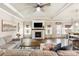 Comfortable living room features a fireplace, ceiling fan, and is open to the dining area, creating a cozy gathering space at 39 Summer Nw Pl, Cartersville, GA 30121
