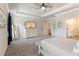 Comfortable primary bedroom featuring tray ceilings, soft carpet, and abundant natural light at 39 Summer Nw Pl, Cartersville, GA 30121