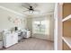 Bright home office with white built-ins, large window, and modern ceiling fan at 39 Summer Nw Pl, Cartersville, GA 30121