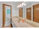 Bathroom featuring vanity, duel sinks and a large mirror at 4856 Rock Haven Dr, Lilburn, GA 30047