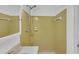 Bathroom with a classic vanity and a shower enclosed in yellow tile at 4856 Rock Haven Dr, Lilburn, GA 30047
