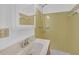 Bathroom featuring vanity, white sink, and a shower stall with yellow tile at 4856 Rock Haven Dr, Lilburn, GA 30047