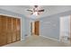 Light blue bedroom with closet and view of en-suite bathroom; neutral carpet at 4856 Rock Haven Dr, Lilburn, GA 30047