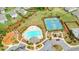 Community amenities featuring a pool, tennis courts, playground and landscaping, as seen from above at 6915 Rambling Vale, Cumming, GA 30028