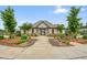 Exterior of clubhouse with manicured landscaping and charming architectural details at 6915 Rambling Vale, Cumming, GA 30028