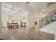 Elegant dining room with coffered ceilings, wainscoting, wood floors, and decorative lighting at 6915 Rambling Vale, Cumming, GA 30028