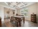 Dining room with hardwood floors, decorative ceiling, and a view into the foyer at 6915 Rambling Vale, Cumming, GA 30028