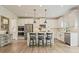Contemporary kitchen with a center island, stainless appliances, and ample cabinet space at 6915 Rambling Vale, Cumming, GA 30028