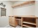 Well-organized laundry room featuring custom shelving and storage solutions for efficient use of space at 6915 Rambling Vale, Cumming, GA 30028