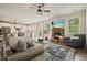 Open concept living room and kitchen, with a fireplace, TV, and ample seating at 6915 Rambling Vale, Cumming, GA 30028